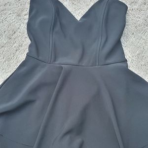 Black Romper with skirt overlay.